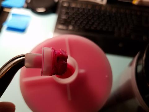 E series inks also come with this nozzle in place, pull it out with pliers