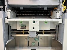 The paper feed cover is removed with 2 screws (it has two plastic arms at the top corners which hook over the metal shelf).