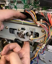 Slowly turning the cam pulley with fingertips above and below (grabbing pulley directly, beneath the belt).