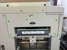 The 5 marked screws secure the plastic panel around the disposal unit.